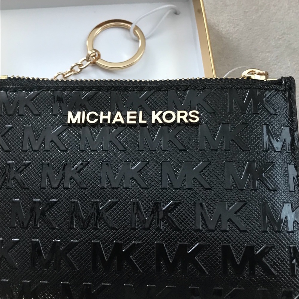 Michael Kors small wallet with keychain.